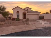 Charming single-story home featuring a landscaped front yard and an attached two-car garage at 6279 S Martingale Ct, Gilbert, AZ 85298