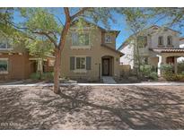 Charming two-story home featuring desert landscaping and a welcoming front porch at 20563 W White Rock Rd, Buckeye, AZ 85396
