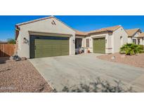 Charming home featuring a spacious driveway and two-car garage, offering both convenience and curb appeal at 20916 E Arroyo Verde Dr, Queen Creek, AZ 85142