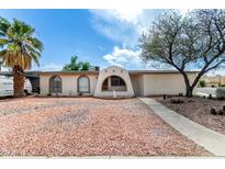Charming one-story home featuring unique architectural details and desert-friendly landscaping at 1159 W Emelita Ave, Mesa, AZ 85210
