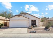Charming single-story home featuring a two-car garage and low-maintenance desert landscaping at 2123 E Catclaw St, Gilbert, AZ 85296