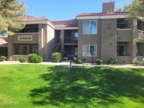Well-maintained two-story apartment complex with lush green lawn and desert landscaping in a desirable community setting at 2929 W Yorkshire Dr # 2118, Phoenix, AZ 85027