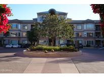 Attractive apartment building entrance with manicured landscaping in flower bed and parking lot at 435 W Rio Salado Pkwy # 210, Tempe, AZ 85281