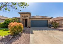 Charming single-story home with a two-car garage and mature desert landscaping at 581 W Angus Rd, San Tan Valley, AZ 85143