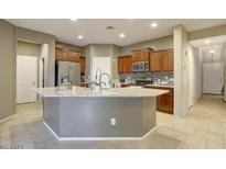 Stylish kitchen with stainless steel appliances, granite countertops, and ample cabinet space at 9009 S 57Th Dr, Laveen, AZ 85339