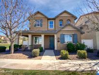 Charming two-story home featuring a well-maintained front yard and inviting curb appeal at 10418 E Nopal Ave, Mesa, AZ 85209