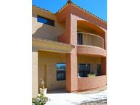 Charming two-story condo featuring a quaint balcony and warm, inviting colors at 16216 N 30Th Pl, Phoenix, AZ 85032