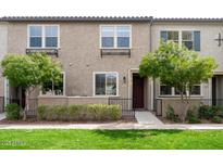 Charming townhome featuring a well-maintained lawn, neatly trimmed bushes, and an inviting entryway at 2660 S Equestrian Dr # 106, Gilbert, AZ 85295