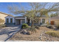 Charming single-Gathering home featuring a neutral color palette, desert landscaping, and a covered driveway at 3933 W Sandra Ter, Phoenix, AZ 85053