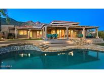 Inviting backyard pool area with outdoor seating and mountain views, perfect for relaxing at 6643 E El Sendero Rd, Carefree, AZ 85377