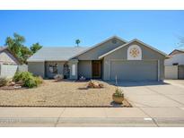 Charming single-story home featuring xeriscape landscaping and a two-car garage at 665 W Shawnee Dr, Chandler, AZ 85225