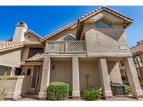 Inviting two-story home featuring a stucco exterior, tiled roof, and a charming balcony at 1001 N Pasadena -- # 5, Mesa, AZ 85201