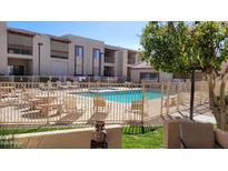 Apartment complex featuring a refreshing swimming pool and well-maintained outdoor amenities for residents to enjoy at 205 N 74Th N St # 227, Mesa, AZ 85207