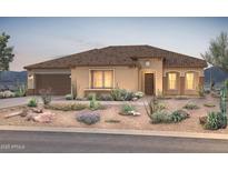 Inviting single-story home boasting desert landscaping, a warm color palette, and an attached two-car garage at 26979 W Renee Dr, Buckeye, AZ 85396