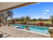 Inviting pool with integrated spa offers stunning golf course views and outdoor entertaining space at 11922 N 120Th St, Scottsdale, AZ 85259