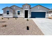 A charming single-story home boasting a well-maintained yard and a modern blue garage door at 12443 E Bahia Ct, Florence, AZ 85132
