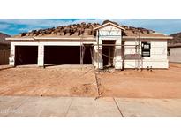 New construction home featuring a two-car garage and a modern design at 12456 E Bahia Ct, Florence, AZ 85132