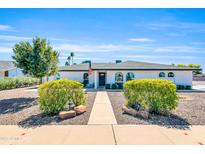 Charming single-story home with well-maintained landscaping and a welcoming walkway at 1607 E Gable Ave, Mesa, AZ 85204