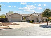 Attractive single-story home featuring a well-kept yard, desert landscaping, and a two-car garage at 19305 E Oriole Way, Queen Creek, AZ 85142