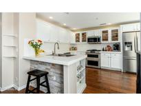 Bright kitchen featuring white cabinets, stainless steel appliances, and tile countertops at 33550 N Dove Lakes Dr # 1041, Cave Creek, AZ 85331
