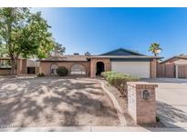 Charming single-story brick home with a two-car garage and a well-manicured front yard at 7416 S Mcallister Ave, Tempe, AZ 85283
