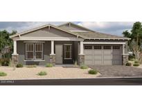 Charming single-story home with neutral paint, stone accents, covered front porch, and two-car garage at 11432 E Utopia Ave, Mesa, AZ 85212