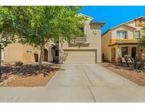 Two-story home with neutral stucco, a two-car garage, and a landscaped front yard at 11732 W Foothill Dr, Sun City, AZ 85373