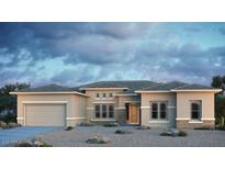 Contemporary home featuring a neutral color scheme, well-manicured landscaping, and a spacious two-car garage at 18921 E Ashridge Dr, Queen Creek, AZ 85142