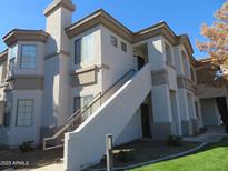 Beautiful two-story condo with desert landscaping and light neutral color palette, inviting for new owners at 1941 S Pierpont Dr # 2082, Mesa, AZ 85206