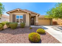 Charming single-story home featuring a well-manicured front yard and a two-car garage at 2831 W Carson Rd, Phoenix, AZ 85041