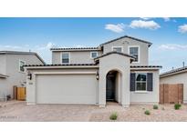 Charming two-story home with a two-car garage and neutral paint, offers a welcoming curb appeal at 3974 E Ghost Flower Ln, San Tan Valley, AZ 85140