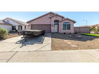 Charming single-story home featuring a well-maintained landscape and a spacious driveway at 16150 N 86Th Ave, Peoria, AZ 85382