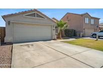 Charming single-Gathering home with a spacious driveway and well-maintained front yard landscaping at 7329 W Lamar Rd, Glendale, AZ 85303