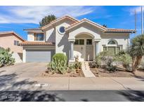 Charming home featuring a two-car garage and desert landscaping in a well-maintained front yard at 3932 W Rene Dr, Chandler, AZ 85226