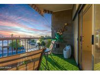 Cozy balcony with a chair and table perfect for enjoying sunrise and sunset views at 425 S Parkcrest Dr # 334, Mesa, AZ 85206
