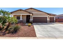 Beautiful single-Gathering home with a well-maintained front yard and a two-car garage at 45975 W Mountain View Rd, Maricopa, AZ 85139