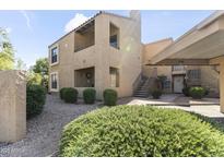 A charming condo featuring well-maintained landscaping and a two-story exterior design with private balconies at 8787 E Mountain View Rd # 2016, Scottsdale, AZ 85258