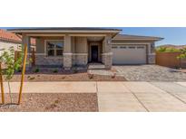 Charming single-story home with a well-manicured yard and inviting stone-accented facade at 21829 E Bonanza Ct, Queen Creek, AZ 85142