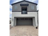 Two-story home with a two-car garage and a balcony on the second floor at 2470 W Rowel Rd, Phoenix, AZ 85085