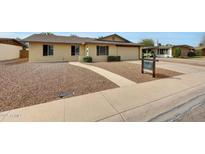 Charming single-story home with a well-maintained front yard and a welcoming walkway at 1619 E Del Rio Dr, Tempe, AZ 85282