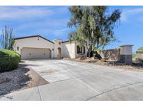 Attractive single-story home with a two-car garage and desert landscaping at 17002 S 178Th Ave, Goodyear, AZ 85338