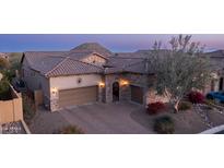 Elegant stucco and stone home featuring a tile roof and an inviting brick driveway at 1903 N Lynch --, Mesa, AZ 85207