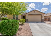 Charming single-story home featuring a well-maintained front yard with desert landscaping and a two-car garage at 2167 W Ethan Ct, San Tan Valley, AZ 85144
