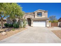 Charming two-story home with a desert landscape, long drive way and a well-maintained lawn at 2982 E Boston St, Gilbert, AZ 85295