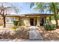 Charming single-story home featuring a cozy front porch and desert landscaping at 3343 E Ivanhoe St, Gilbert, AZ 85295