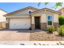 Charming single-story home with stone accents, desert landscaping and a two car garage at 5259 S Hadron --, Mesa, AZ 85212