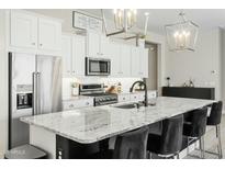 Stylish kitchen features granite counters, stainless appliances, and pendant lighting at 1816 N Bernard Cir, Mesa, AZ 85207