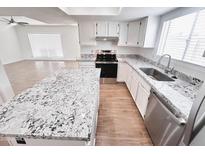 Open concept kitchen features stainless steel appliances and granite countertops at 2416 W Stottler Dr, Chandler, AZ 85224