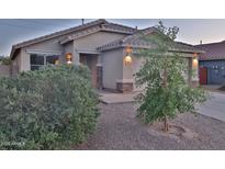 Charming single-story home features a tile roof, desert landscaping, and inviting entry at 803 W Burkhalter Dr, San Tan Valley, AZ 85143