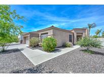 Single story home featuring a tile roof and low maintenance desert landscaping in front yard at 2116 E Beautiful Ln, Phoenix, AZ 85042